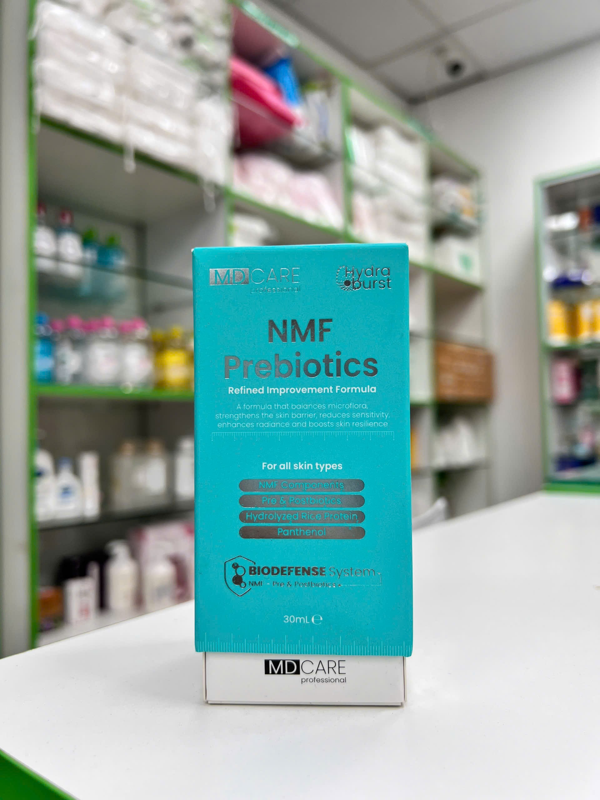 Serum Cân Bằng Lợi Khuẩn & Phục Hồi Hàng Rào Bảo Vệ Da NMF Prebiotics — hộp sản phẩm tông xanh ngọc với thông điệp phục hồi da